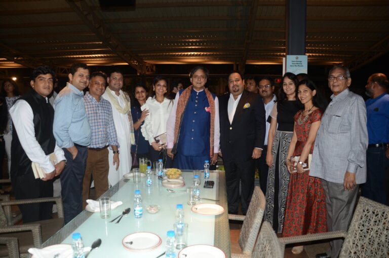 Sundeep Bhutoria with author Shashi Tharoor and enthusiastic attendees after the launch of his book at the Calcutta Rowing Club