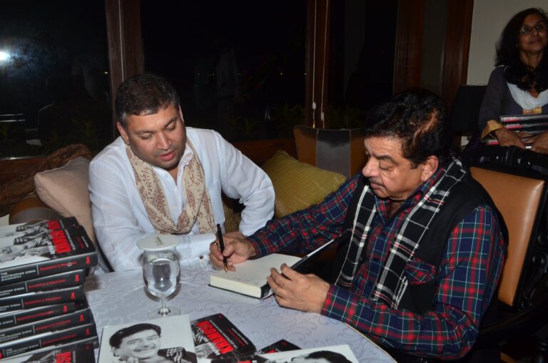 Sundeep Bhutoria with Shatrughan Sinha signing off a copy of his biography Anything But Khamosh at a session of An Author's Afternoon at the Taj Bengal in Kolkata