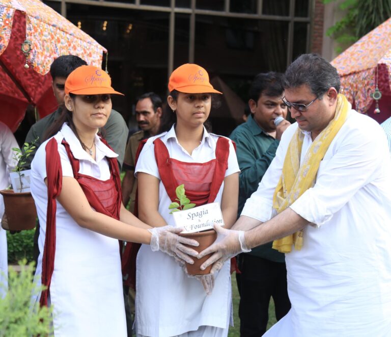 Sundeep Bhutoria handling over saplings to school students at a Tree Plantation event held at the ITC Rajputana, Jaipur