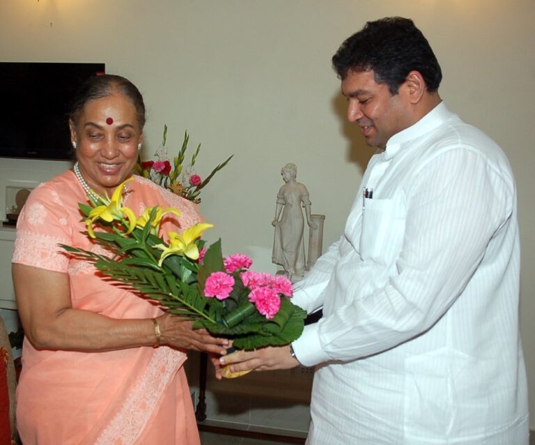 Sundeep Bhutoria presenting floral bouquet to Margaret Alva