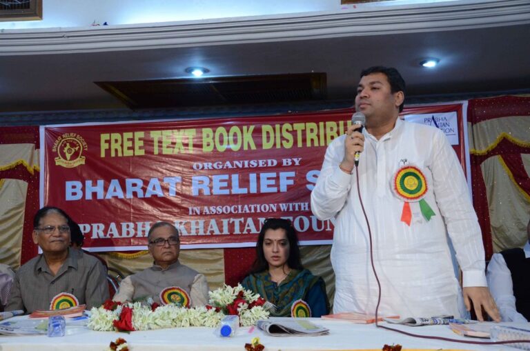 Sundeep Bhutoria delivering a speech at a book distribution function of Bharat Relief Society in Kolkata with Pradip Chatterjee, Arpita Chatterjee and others