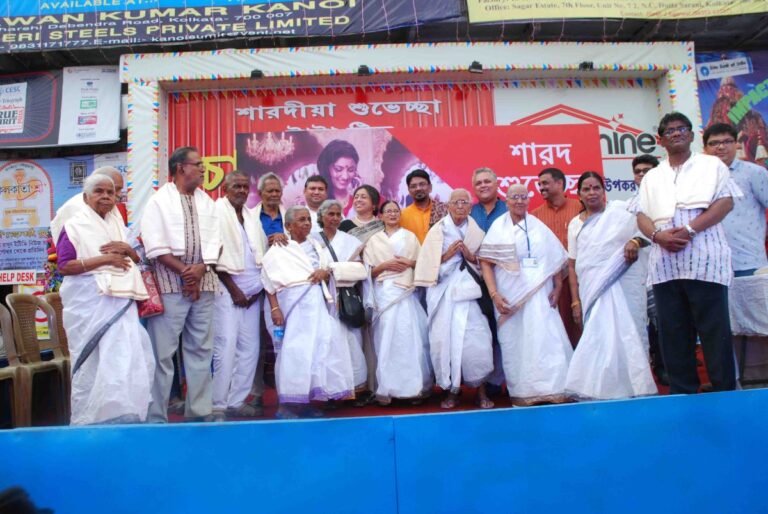 Sundeep Bhutoria with senior citizens at the Maniktalla Chaltabagan Durga Puja in Kolkata