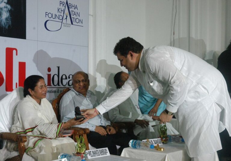 Sundeep Bhutoria presenting a small bust of Tagore