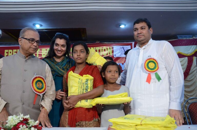 Sundeep Bhutoria with children at the book distribution function of Bharat Relief Society in Kolkata with Pradip Chatterjee, Arpita Chatterjee and others