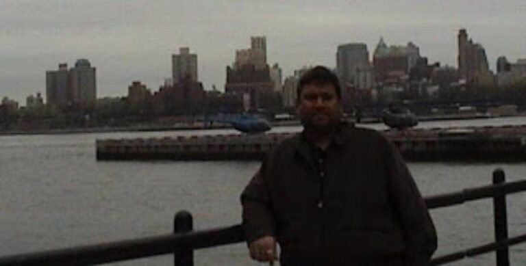 Sundeep Bhutoria in New York near a helipad with the Manhattan skyline in the background