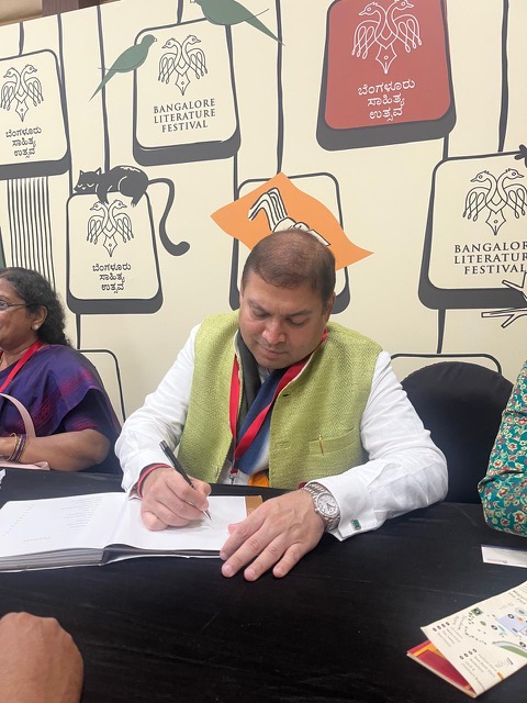 Sundeep Bhutoria signing books at the Bangalore Lit Fest 2024 at the author’s book signing lounge