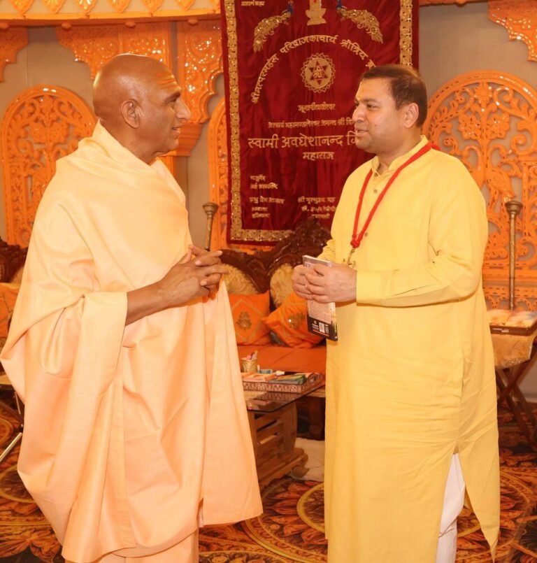 Sundeep Bhutoria with Swami Avdheshanand Giri - Acharya Mahamandleshwar Juna Akhara where he presented a copy of his book ‘Unfolding Divinity Within’